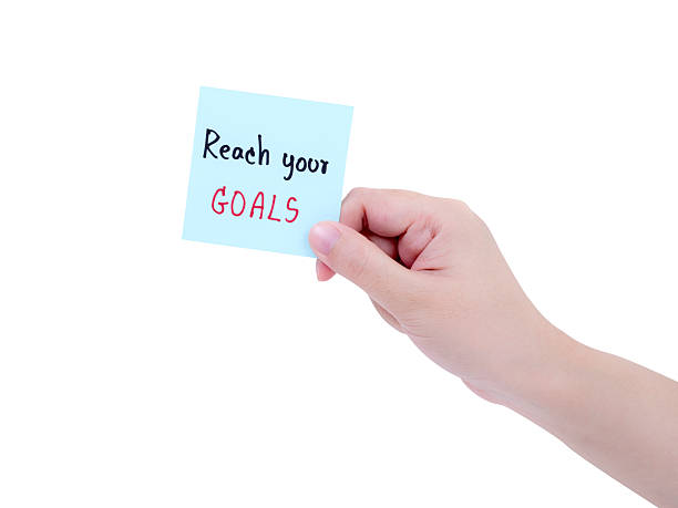 istock Single woman hold Reach your goal on notepad 1 543812404