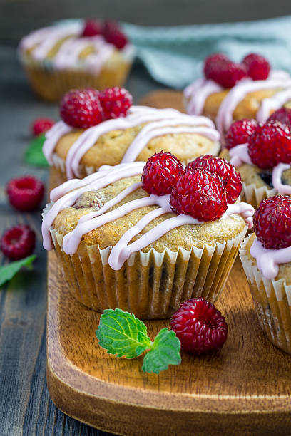 istock Banana bread muffins with raspberries, cherries and white chocolate 543813026
