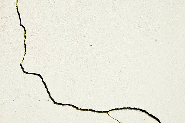 istock Large crack at a corner of a white wall 543813120