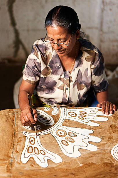 istock Sri Lankan woman making batik near Kandy 543814320