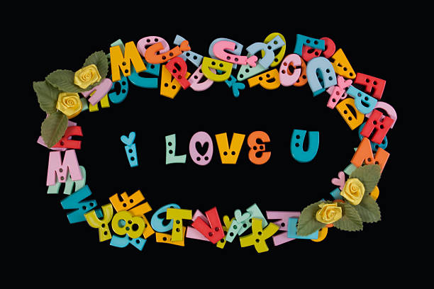i love you phrase written by plastic letters on blackboard. - plastic poppy imagens e fotografias de stock