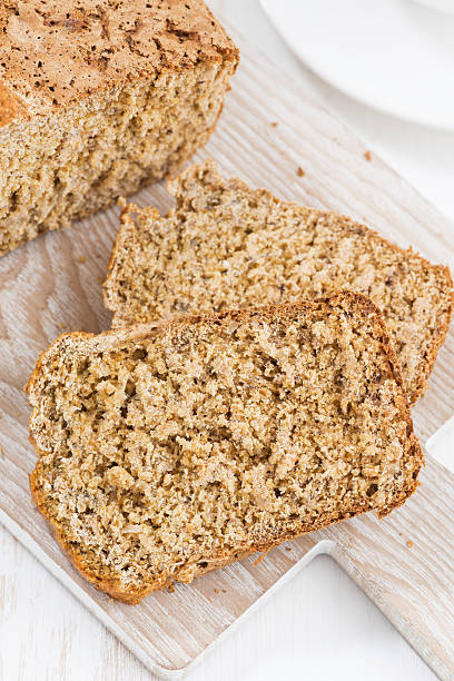 istock banana bread on a cutting board, top view, closeup 543817792