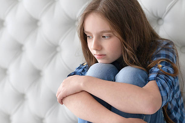 istock sad little girl  at home 543820000