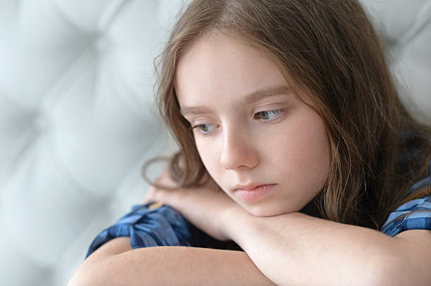 istock sad little girl  at home 543820134