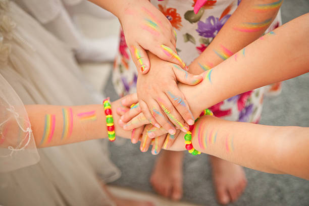 istock United children's hands closeup. the painted 543820246