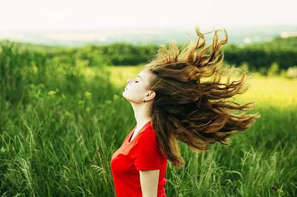 istock Young woman stay is burned field. 543820432
