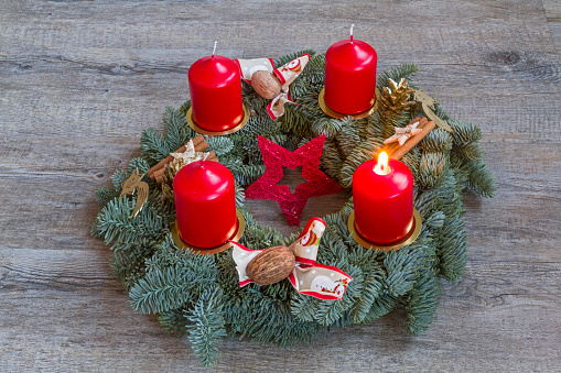 Advent wreath with a lighted candle