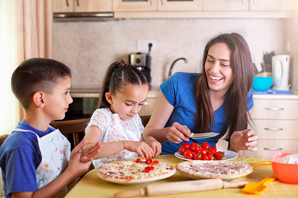 istock Family making pizza together 543825720