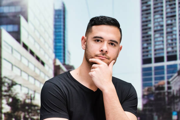 istock Casual man standing outdoor and looking at camera 543826360