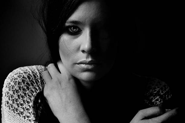 istock black and white portrait young woman looking at camera 543826718