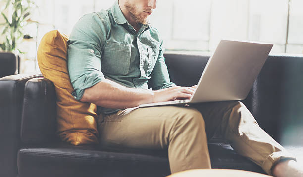 istock Bearded Hipster working Laptop modern Interior Design Loft Office.Man 543827050