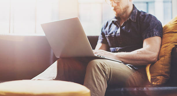 istock Bearded Hipster working Laptop modern Interior Design Loft Office.Man 543827246