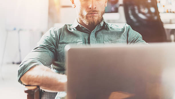 istock Bearded Style Businessman work Laptop modern Design Interior Loft Studio 543827328