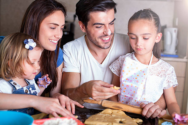 istock Happy family baking cookies 543827850