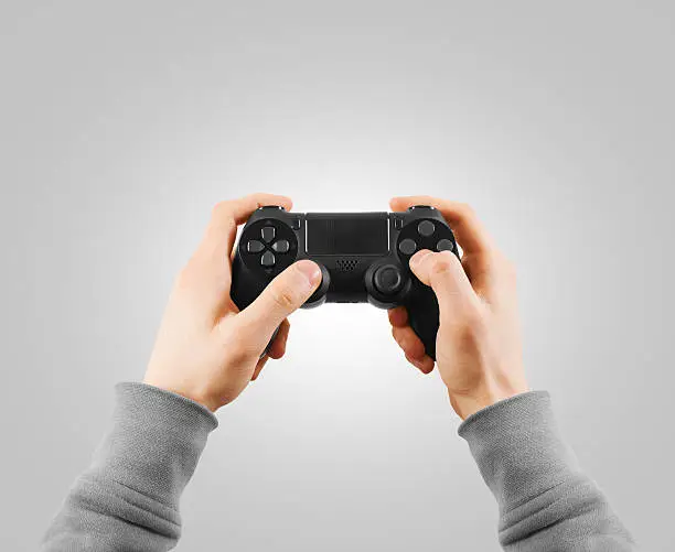 Hand hold new joystick isolated. Gamer play game with gamepad controller.