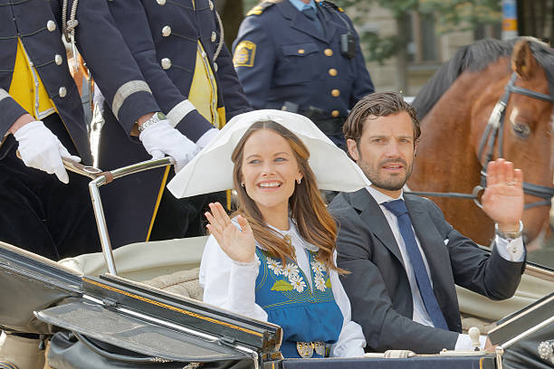The swedish princess and prince Sofia and Carl Philip Bernadotte Stockholm, Sweden - June 06, 2016: The swedish princess and prince Sofia and Carl Philip Bernadotte smiling and waiving to the audience from the royal coach on their way to celebrate the swedish national day. djurgarden photos stock pictures, royalty-free photos & images