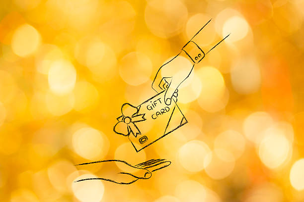 hand giving a gift card with wrapping bow stock photo