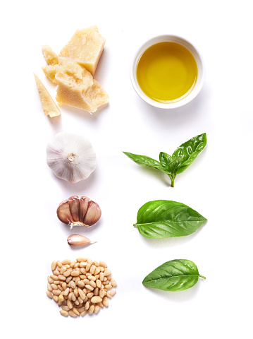ingredients for pesto isolated on white background. top view