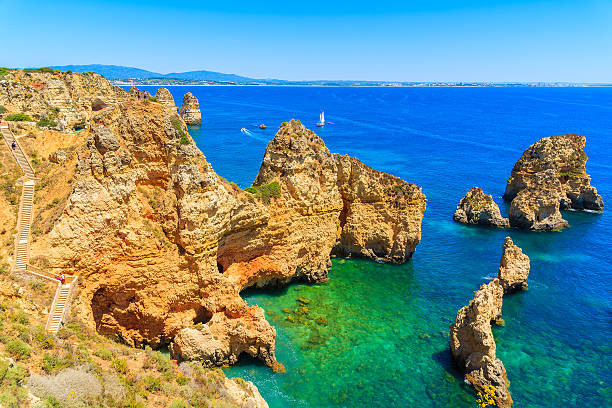 istock Cliff rocks and sea bay with turquoise water 543832530
