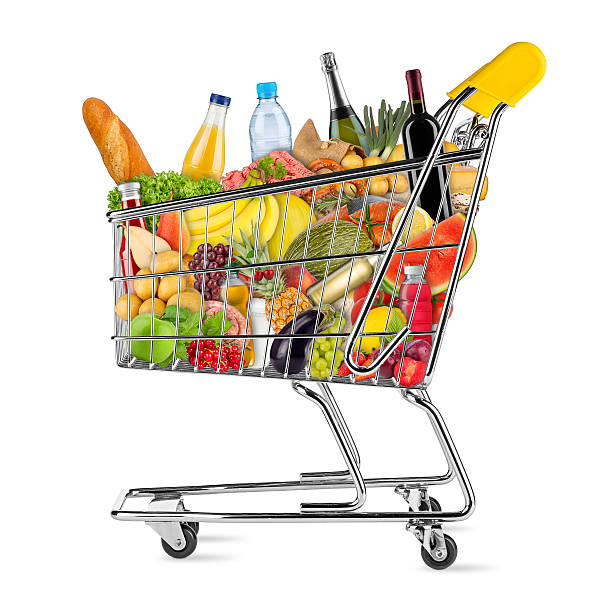 isolated shopping cart filled with food yellow shopping cart filled with various food and beverages isolated on white background full stock pictures, royalty-free photos & images