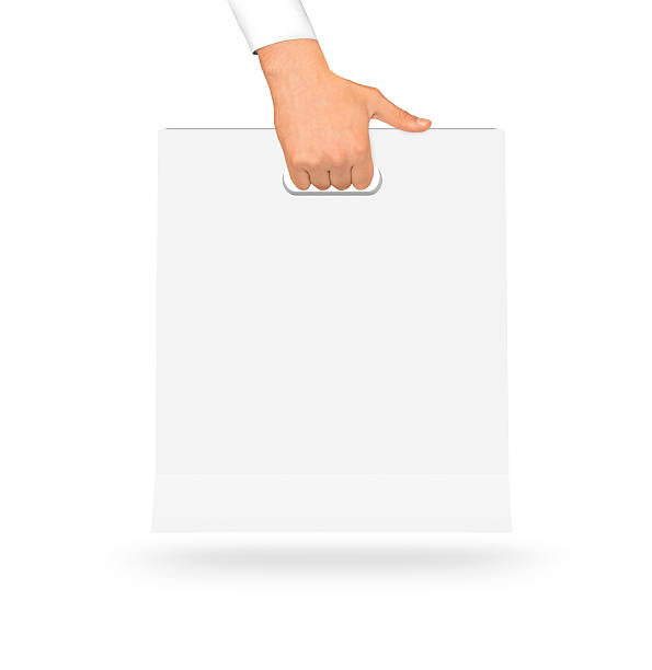 istock Blank white paper bag mock up holding in hand. Empty 543835118