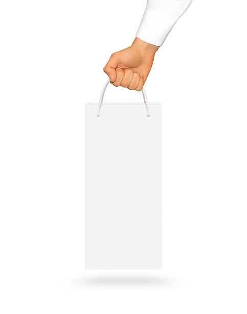 istock Blank white wine paper bag mock up holding in hand 543835144