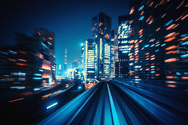 abstract motion-blurred view from a moving train abstract motion-blurred view from the front of a train in Tokio, Japan light commercial vehicle stock pictures, royalty-free photos & images