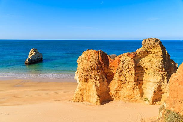 istock Golden color rocks on Praia da Rocha beach 543835730