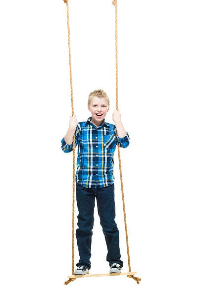 istock Smiling little boy swinging 543835814