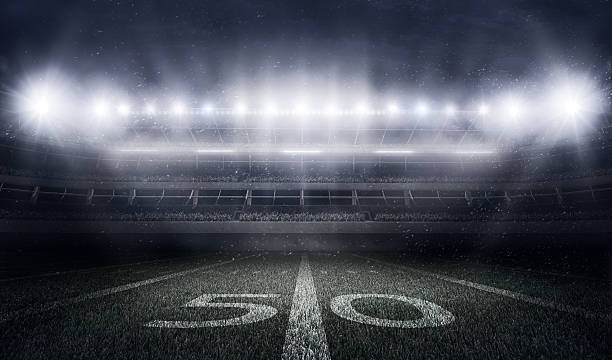 stade de football américain dans les lumières et les flashs - football américain photos et images de collection