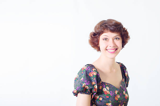 Colorful picture of beautiful slim young woman with short hair on white background. Girl looking at camera