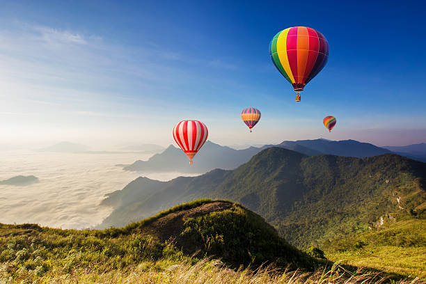 istock Colourful hot-air balloons flying over the mountain 543839546