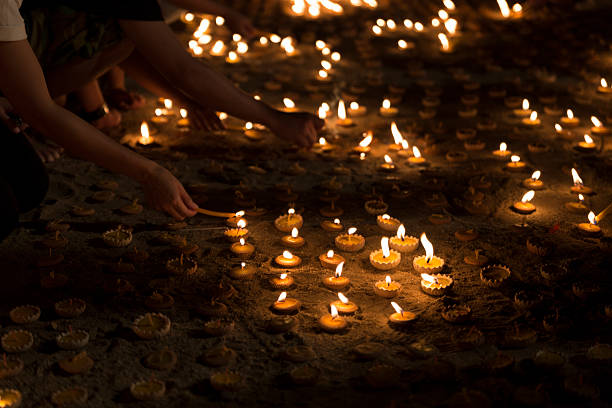 istock People light candle to pay respect to buddha relic 543840572