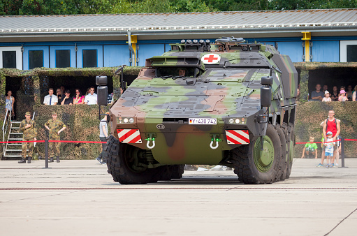 Burg, Germany - June 25, 2016: german armoured ambulance vehicle, Boxer drives on open day in barrack burg / germany at june 25, 2016.