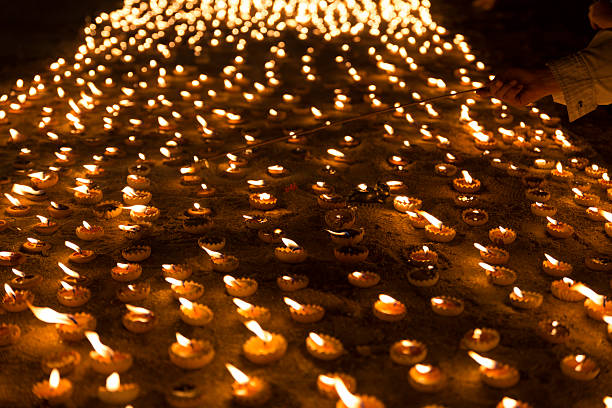 istock People light candle to pay respect to buddha relic 543841354