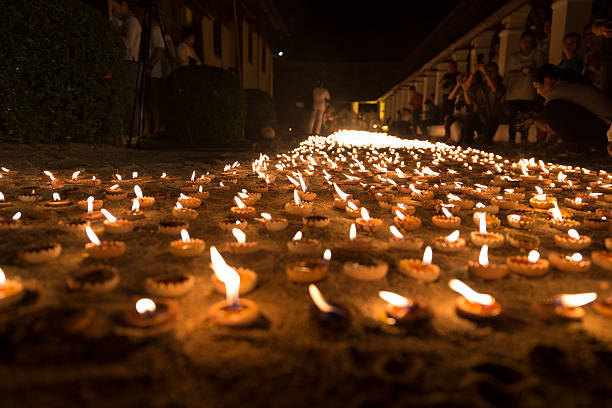 Chiang Mai, Thailand - June 10, 2016: candle light to pay respect to buddha relic at buddhist temple at Tonkwen temple in Chiang Mai, Thailand on June 10, 2016.