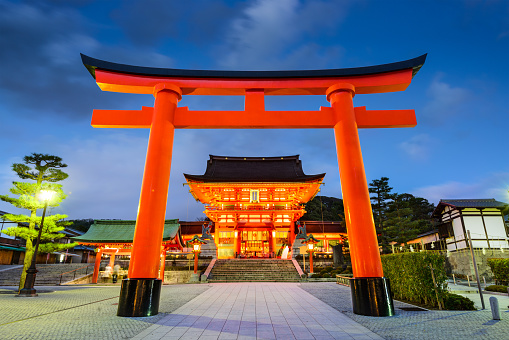 Kyoto, Japan - April 6, 2014: Fushimi Inari Grand Shrine at twilight. Founded in 711, the popular shrine is said to have as many as 32,000 sub-shrines across Japan.