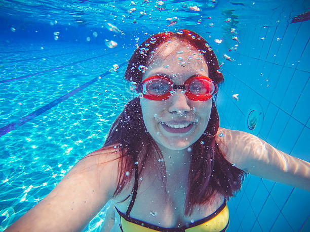 istock Girl under the water 543976240