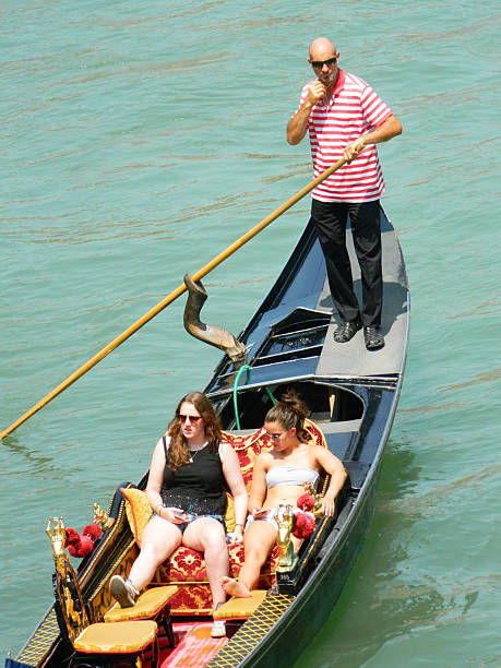 Gondolas with tourists stock photo