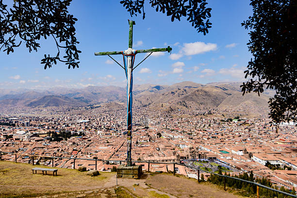 Cristian cross on a hilltop overlooking the city of Cusco, Peru