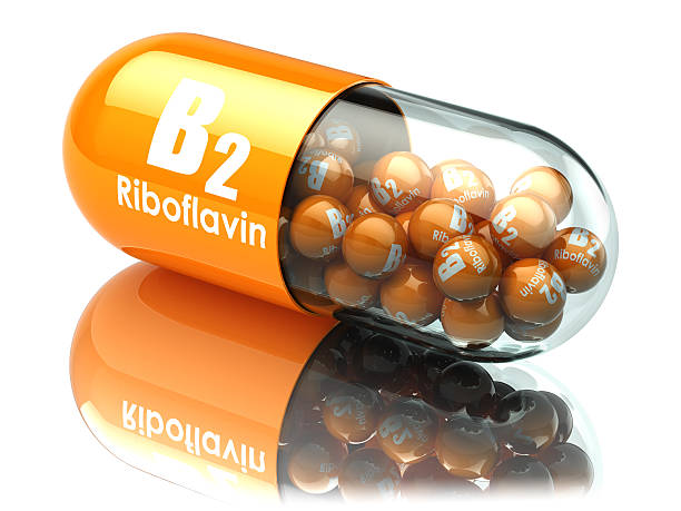 ビタミンb2カプセル。リボフラビンでピル。栄養補助食品. - b 2 b ストックフォトと画像