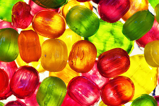 istock The background from scattering of multicolored candy 543982350
