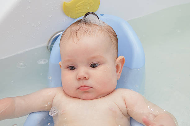 istock Newborn baby bathe and swim 543983736