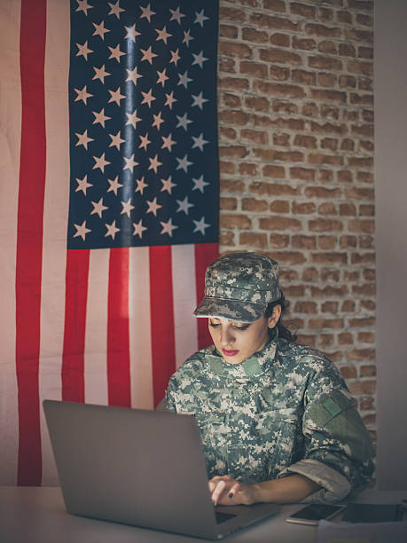 istock Woman soldier hacker trying to break firewall on website 543985724