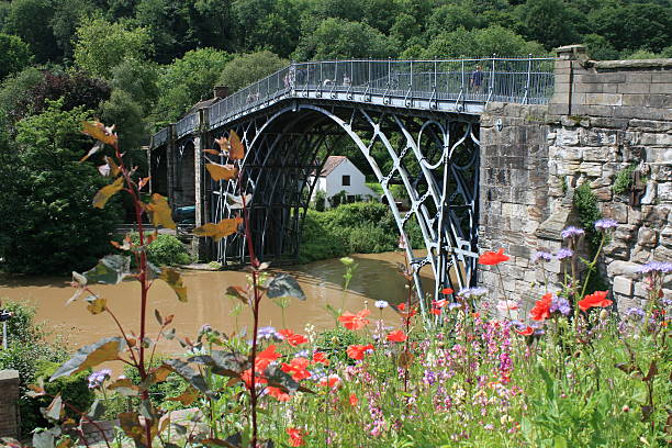 Ironbridge Ironbridge is a village on the River Severn, at the heart of the Ironbridge Gorge, in Shropshire, England. It lies in the civil parish of The Gorge, in the borough of Telford and Wrekin ironbridge shropshire stock pictures, royalty-free photos & images