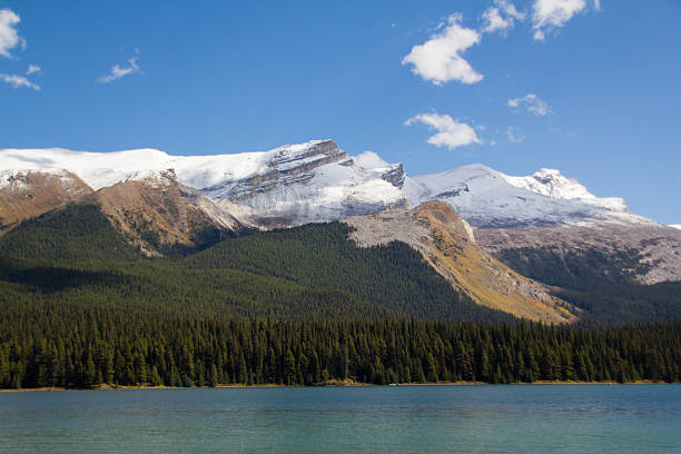 istock Snow-capped mountains at Maligne Lake 543986952