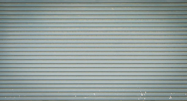 istock Closed Rustic shop retail metal gate for background. 543986954