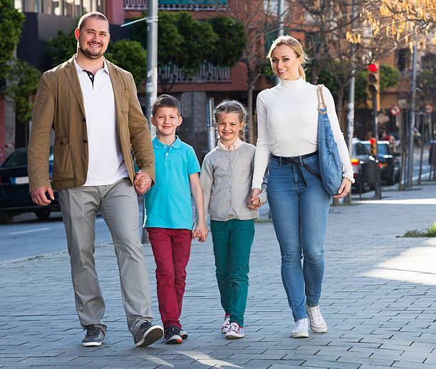 istock Family taking a walk in town 543988410
