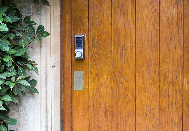 Electronic Door Handle With Numeric Buttons on Old Door - fotografia de stock