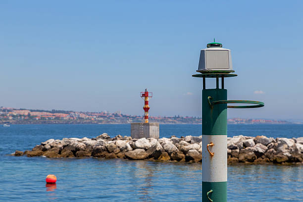 navigation baken on coast a sea before port